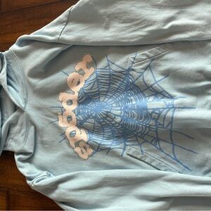 sky blue spider hoodie with rhym stones